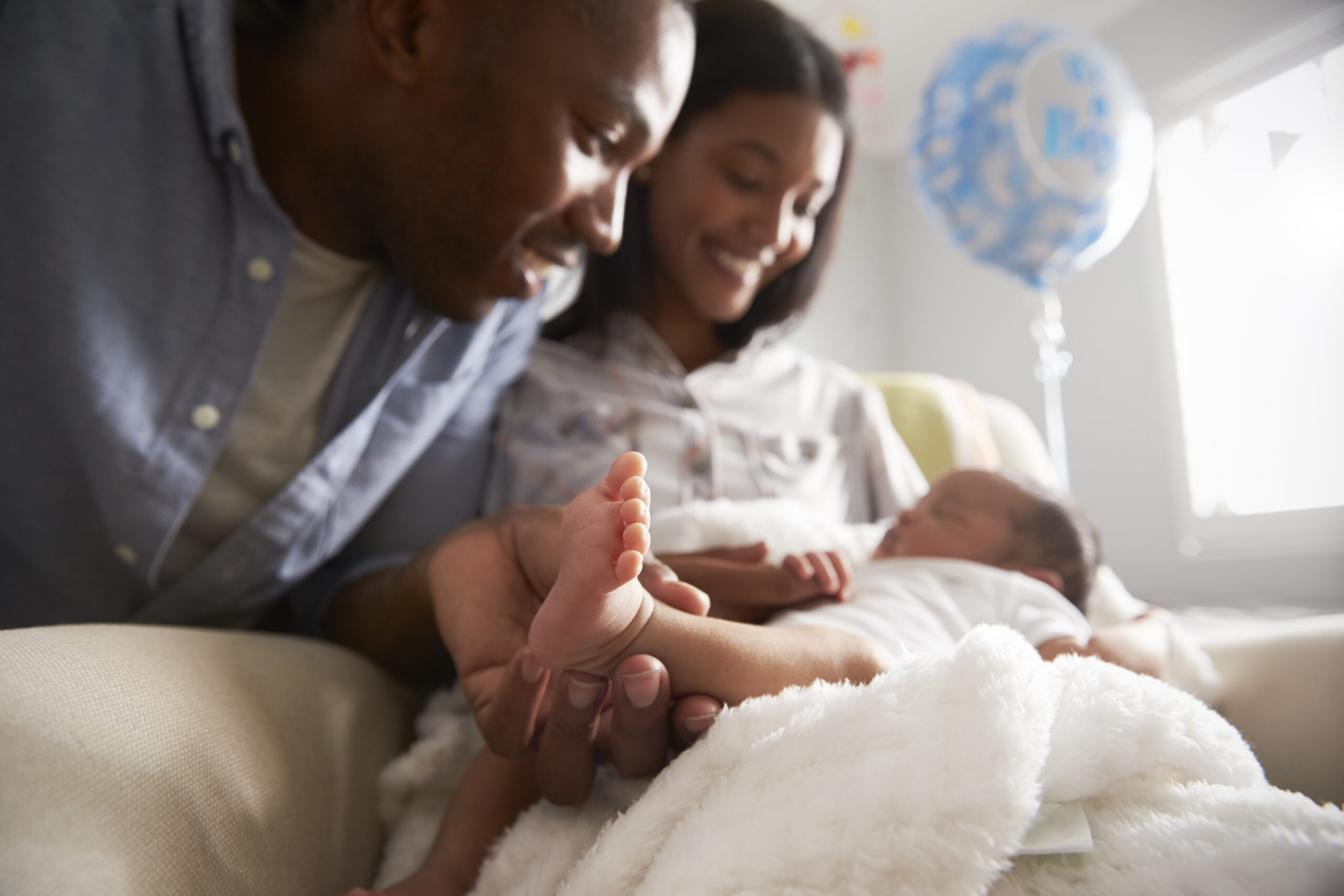 Parents holding newborn baby
